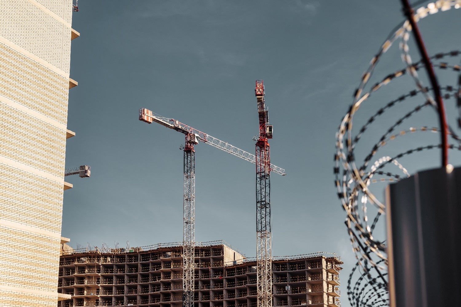 construction-cranes-work-on-creation-site-against-2025-03-19-19-07-47-utc (1)