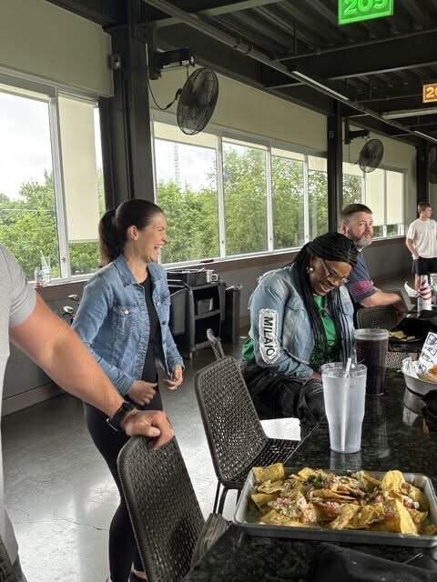 Semper Secure team members laughing together at a company outing