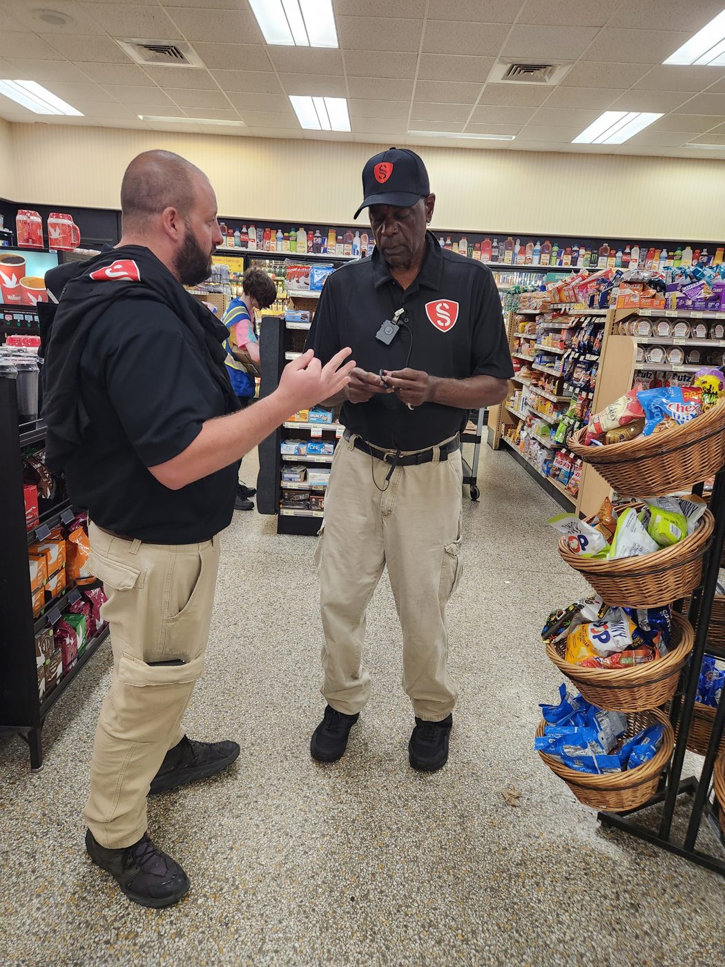 Semper Secure loss prevention officers on post inside a Wawa store.